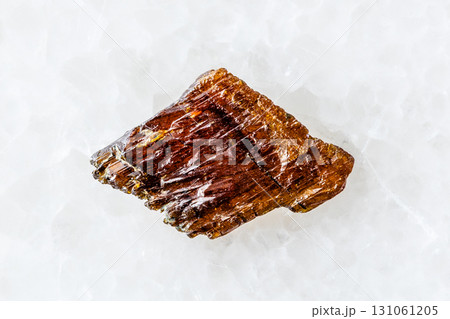 sample of raw rutile mineral on white marble 131061205