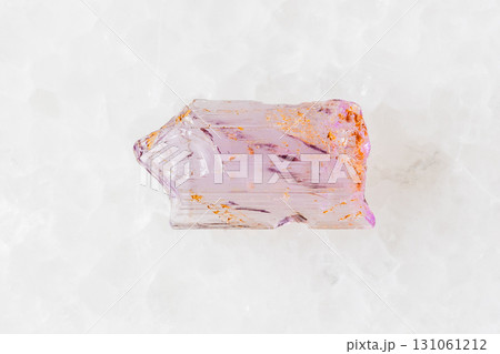 sample of rough purple scapolite crystal on white 131061212