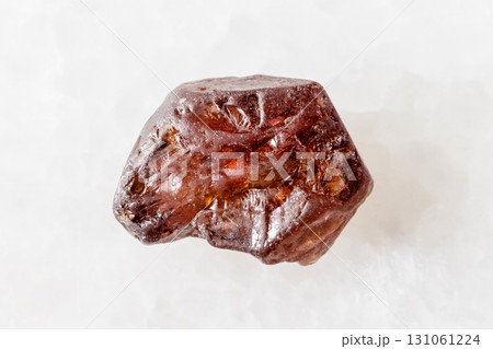 sample of raw hyacinth zircon crystal on white 131061224