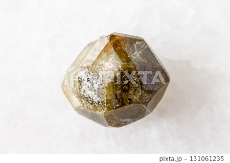 sample of raw grossular garnet crystal on white 131061235