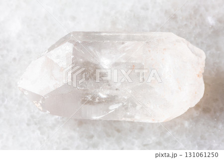 sample of rough rock crystal on white marble 131061250