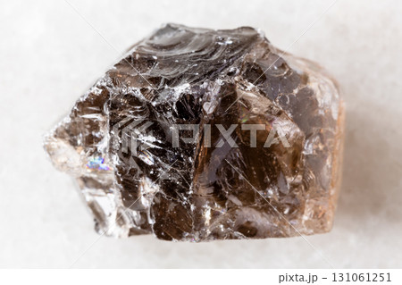 sample of raw smoky quartz mineral on white 131061251