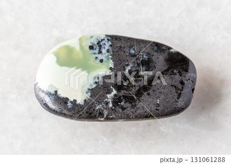 sample of polished khantigirite mineral on white sample of polished khantigirite mineral on white 131061288