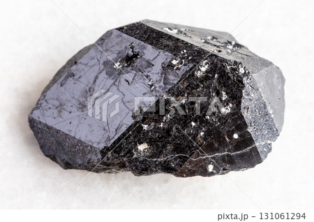 raw melanite andradite black garnet on white raw melanite andradite black garnet on white 131061294