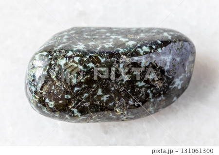 sample of tumbled gabbro-norite rock on white sample of tumbled gabbro-norite rock on white 131061300