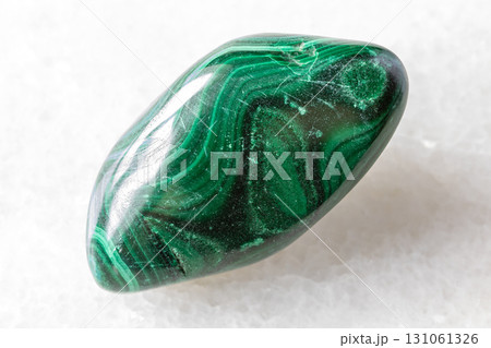 sample of tumbled malachite mineral on white sample of tumbled malachite mineral on white 131061326