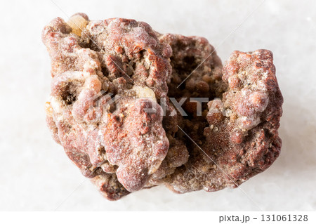 sample of rough chalcedony mineral on white marble 131061328