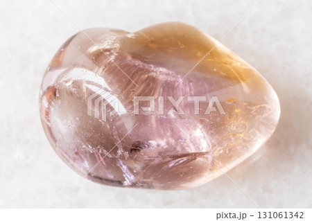 sample of polished ametrine mineral on white sample of polished ametrine mineral on white 131061342