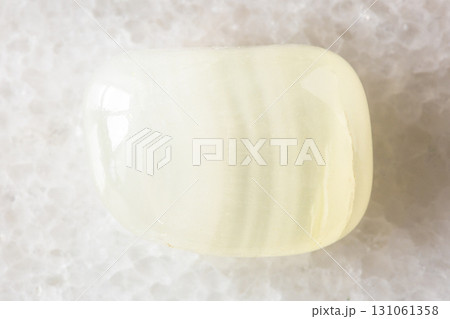 sample of polished colorless calcite rock on white sample of polished colorless calcite rock on white 131061358