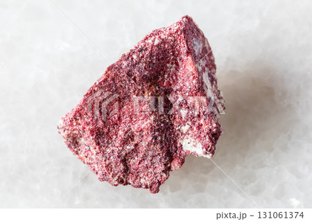 sample of rough cinnabar mineral on white marble sample of rough cinnabar mineral on white marble 131061374