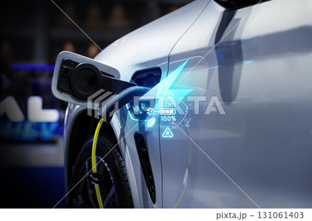 Power cable pump plug in charging power to electric vehicle EV car. Power cable pump plug in charging power to electric vehicle EV car. 131061403