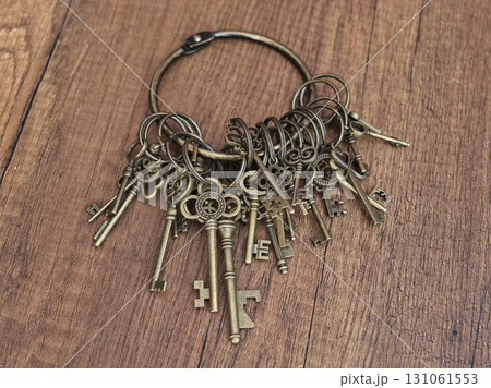Old brass keys on a ring displaying intricate designs Old brass keys on a ring displaying intricate designs 131061553