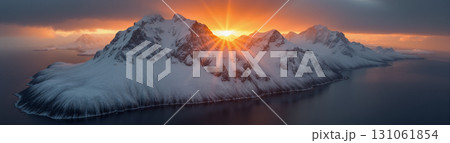 A beautiful northern landscape at sunset, with snow-covered mountains and a lake. 131061854
