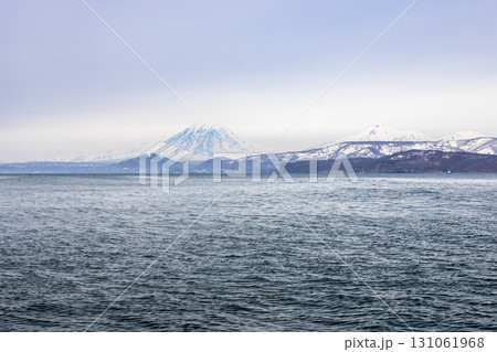 blue gray sky over bay shore in Pacific ocean 131061968