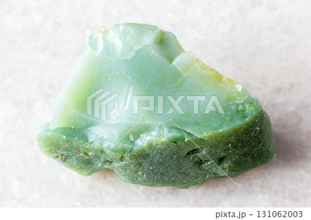 sample of raw chrysoprase rock on white marble 131062003