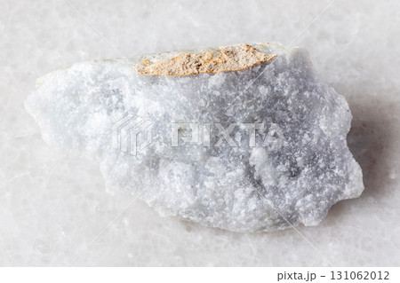 sample of raw jadeite mineral on white marble sample of raw jadeite mineral on white marble 131062012