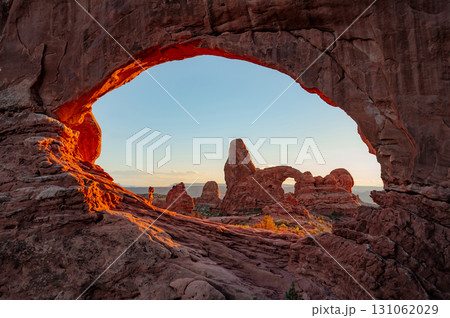 Turret arch through the North Window during sunset in Arches National Park, Utah, USA Turret arch through the North Window during sunset in Arches National Park, Utah, USA 131062029