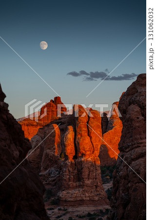 Red rock landscape during sunset with beautiful moon above, Utah, USA Red rock landscape during sunset with beautiful moon above, Utah, USA 131062032