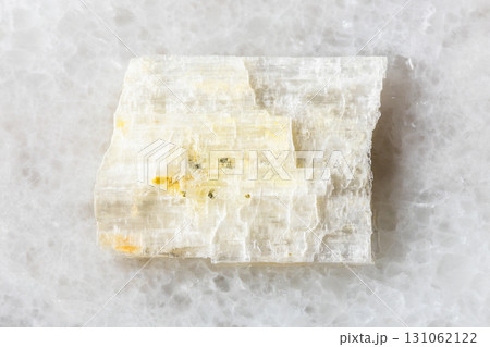 sample of rough eudidymite mineral on white marble sample of rough eudidymite mineral on white marble 131062122