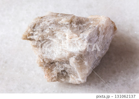 sample of raw oligoclase rock on white marble sample of raw oligoclase rock on white marble 131062137