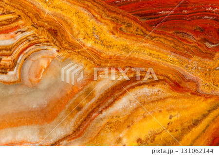 polished surface of banded calcite onyx rock 131062144