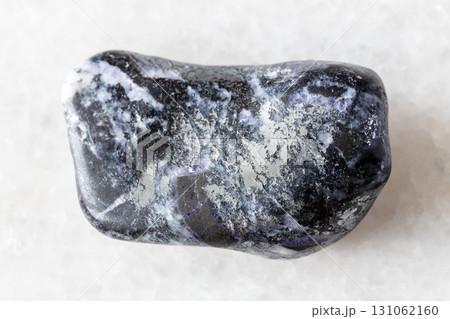 sample of tumbled antimonite mineral on white sample of tumbled antimonite mineral on white 131062160