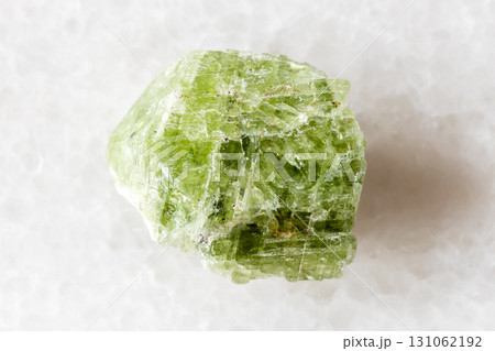 sample of raw diopside crystal on white marble sample of raw diopside crystal on white marble 131062192