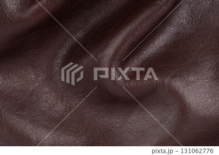 Wrinkled brown leather surface close up Wrinkled brown leather surface close up 131062776