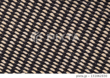 Black and beige woven fabric texture close up 131062830