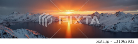 A beautiful northern landscape at sunset, with snow-covered mountains and a lake. A beautiful northern landscape at sunset, with snow-covered mountains and a lake. 131062932