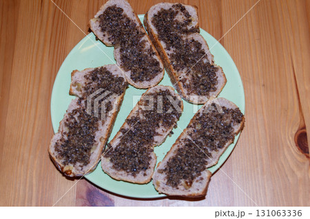 Sandwiches with truffle sauce on wooden table Sandwiches with truffle sauce on wooden table 131063336