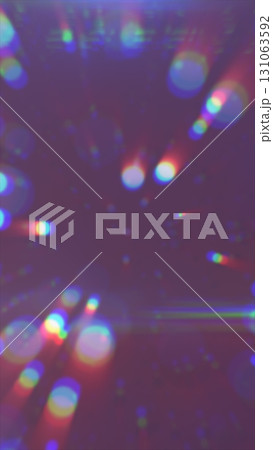 Soft focus abstract light rays and bokeh circles with rainbow chromatic aberration on a purple background 131063592