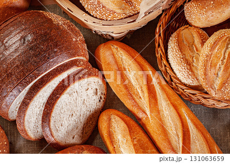Fresh baked bread. Assorted bakery products loafs of bread and rolls... 131063659