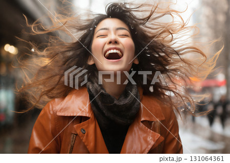 portrait of a beautiful happy woman enjoying winter season 131064361