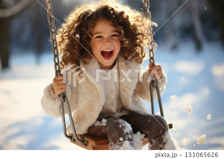 portrait of a child girl enjoying snow and winter portrait of a child girl enjoying snow and winter 131065626