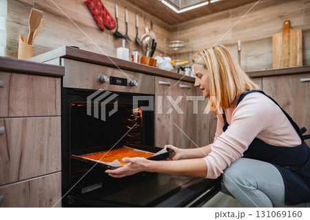 Baking delicious treats in a cozy modern kitchen during afternoon hours 131069160