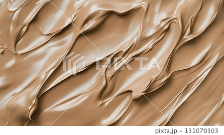 Abstract background shows a glossy pattern of brown liquid with smooth, curved lines 131070303