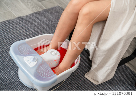Feet in Electric Foot Spa Bath 131070391