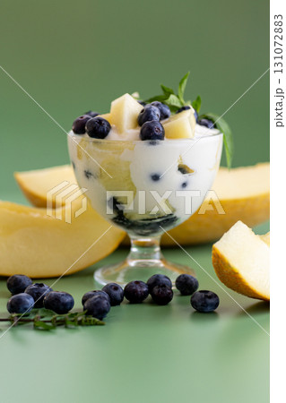 Diet fruit yogurt with melon blueberries and aromatic greens Diet fruit yogurt with melon blueberries and aromatic greens 131072883