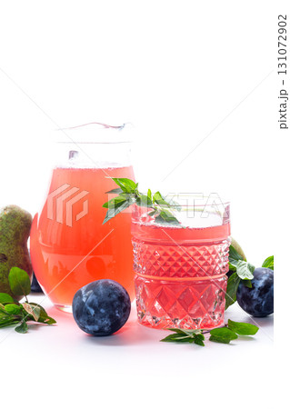 Natural fruit juice from pears and plums with mint leaves Natural fruit juice from pears and plums with mint leaves 131072902