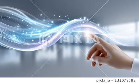 Human hand touching abstract glowing light stream, representing digital interaction and futuristic technology. 131075595