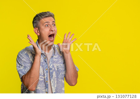 Adult man shocked with hands on cheeks mouth open in disbelief showing wow emotion strong surprise 131077128