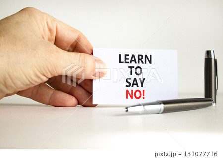 Learn to say no symbol. Concept words phrase Learn to say no on beautiful white card. Businessman's hand. Beautiful white paper background. Business psychological Learn to say no concept. Copy space. Learn to say no symbol. Concept words phrase Learn to say no on beautiful white card. Businessman's hand. Beautiful white paper background. Business psychological Learn to say no concept. Copy space. 131077716