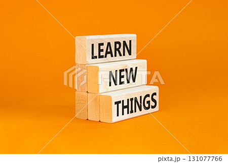 Learn new things symbol. Concept words Learn new things on beautiful wooden blocks. Beautiful orange table orange background. Business motivational learn new things concept. Copy space. Learn new things symbol. Concept words Learn new things on beautiful wooden blocks. Beautiful orange table orange background. Business motivational learn new things concept. Copy space. 131077766
