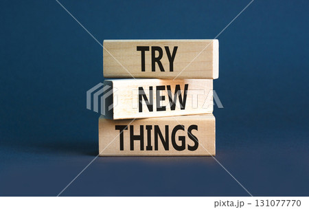Try new things symbol. Concept words Try new things on beautiful wooden block. Beautiful grey table grey background. Business motivational lifestyle try new things concept. Copy space. Try new things symbol. Concept words Try new things on beautiful wooden block. Beautiful grey table grey background. Business motivational lifestyle try new things concept. Copy space. 131077770