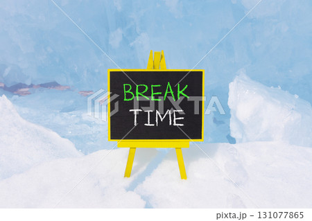 Break time symbol. Concept word Break time on beautiful black blackboard. Beautiful blue Baikal ice and snow background. Black blackboard. Business break time concept. Copy space. Break time symbol. Concept word Break time on beautiful black blackboard. Beautiful blue Baikal ice and snow background. Black blackboard. Business break time concept. Copy space. 131077865