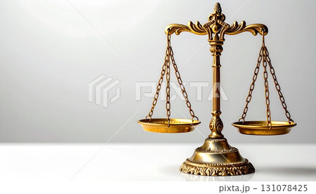 Golden scales of justice isolated on white background, symbolizing law, fairness, equality, judgment, balance, legal system, ethics, morality, and authority 131078425