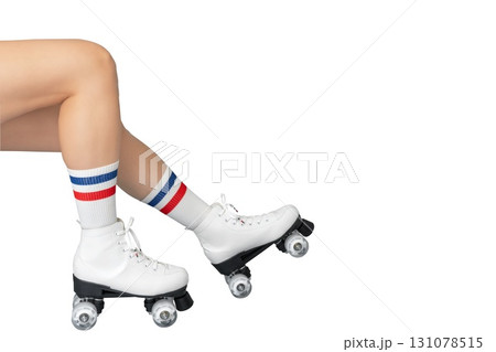 Female legs in roller skates with striped socks on white background 131078515