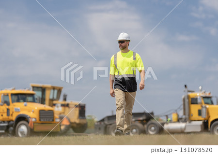 Worker at construction site. Builder construction man. Worker with helmet. Industry worker at construction. Builder civil engineer walk at site building. Supervisor civil engineer. Labor day 131078520