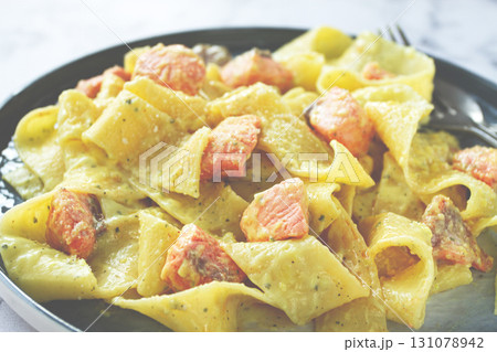 papardelle pasta, in creamy sauce with salmon, homemade, on a gray background, no people, papardelle pasta, in creamy sauce with salmon, homemade, on a gray background, no people, 131078942